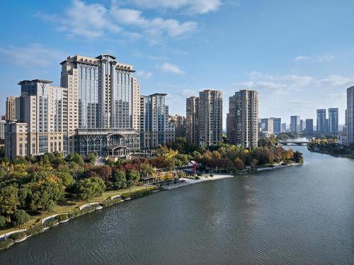 a view of a city with a river and tall buildings at The Azure Ningbo, Vignette Collection in Ningbo