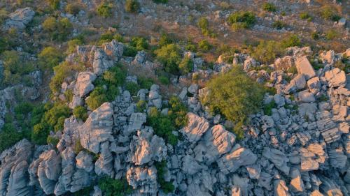 an aerial view of a rocky mountain at The Skyloft Tarchich - Panoramic Retreat with Pool 