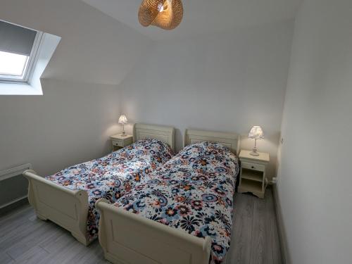 a bedroom with two beds and two night stands at Charmant gîte à la ferme près d'Orléans avec parking privé - FR-1-590-575 