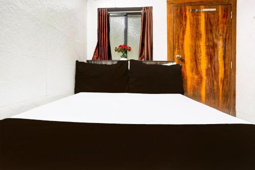 Super Hotel O Dombivali Formerly PK Lodgingにあるベッド