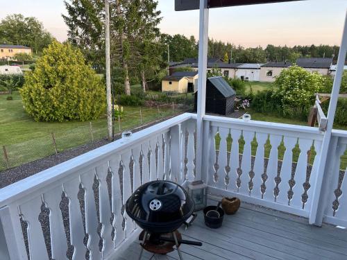 a balcony with a view of a yard at Villa ICRE 23A in Överum
