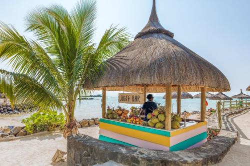 a fruit stand on the beach at a resort at Lagoon Attitude (Adults Only) in Cap Malheureux