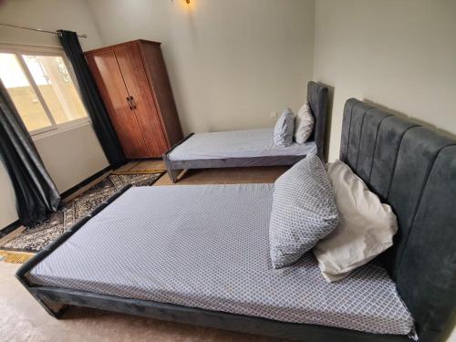 Katil atau katil-katil dalam bilik di Avenue Lodges