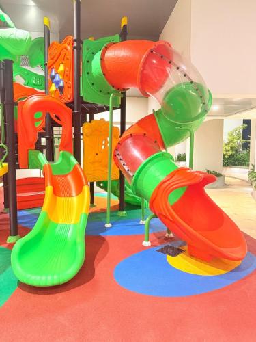 a childrens play area with a colorful playground equipment at Chevalra Luxury TRI-ZEN Apartment in Central Colombo - Galle-Face & Lotus Tower View in Colombo