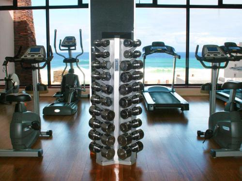 a room with a bunch of racks of wine bottles at Premier Hotel East London ICC in East London