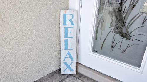 a sign for a door with the word return on a wall at Boaters Dream S. Terr Pool Yacht Club Boating in Cape Coral