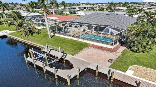 an aerial view of a large house on the water at Boaters Dream S. Terr Pool Yacht Club Boating in Cape Coral
