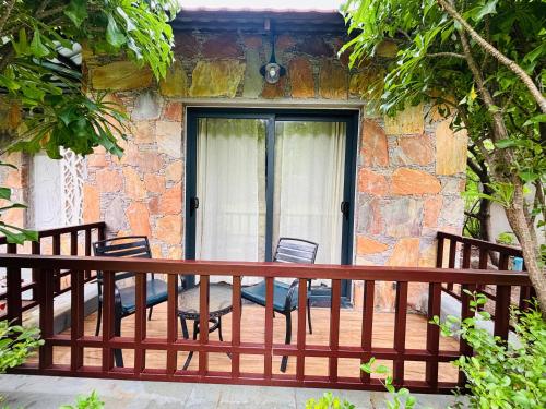 a balcony of a house with a wooden railing at Anandam - A Luxury Resort in Udaipur in Udaipur