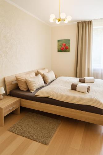 a bedroom with a large bed in a room at Waldhotel Bad Münstereifel in Bad Münstereifel