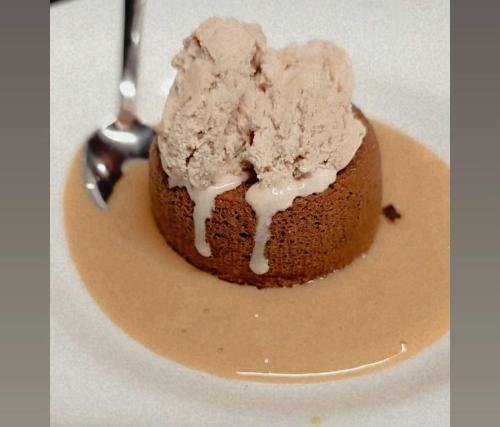 a chocolate cake with ice cream on a plate at FATTORIA L'OTTAVO l'8 LARGE WINE AND OIL PRODUCERS in Lucolena in Chianti
