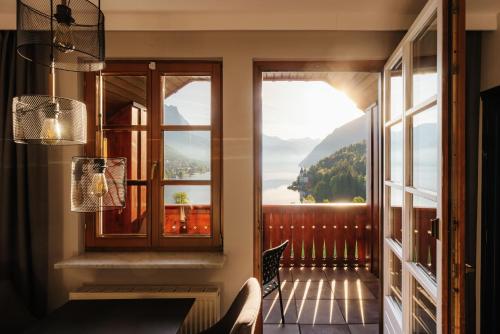 a room with a window and a view of a mountain at MONDI Hotel am Grundlsee in Grundlsee