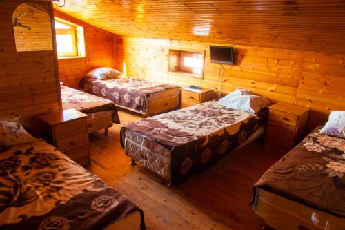 Tempat tidur dalam kamar di Raiskiy Ugolok