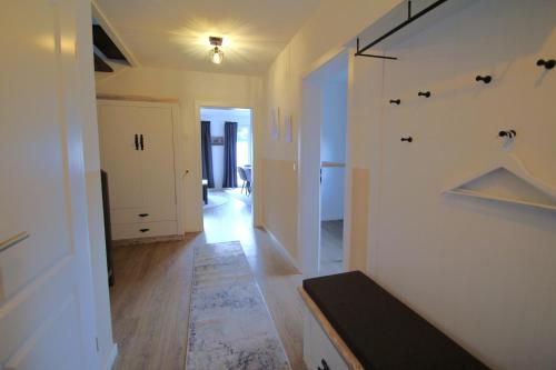 a hallway of a home with a staircase and a living room at Ferienhaus mit Garten in Bad Schwartau für bis zu 6 Personen in Bad Schwartau