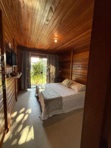 Ένα ή περισσότερα κρεβάτια σε δωμάτιο στο Villa Bangalôs Manguinhos