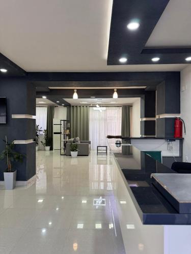 a large room with a lobby with a lobby at Отель Асман in Bosteri
