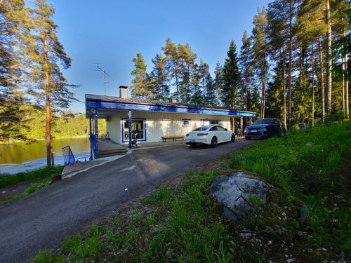 a white car parked in front of a building at Greek house in Salo