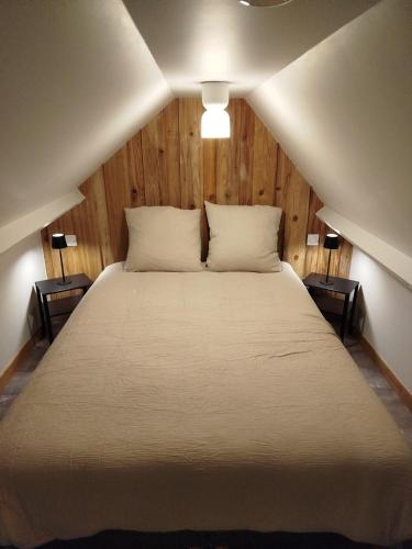 Llit o llits en una habitació de La Petite Maison