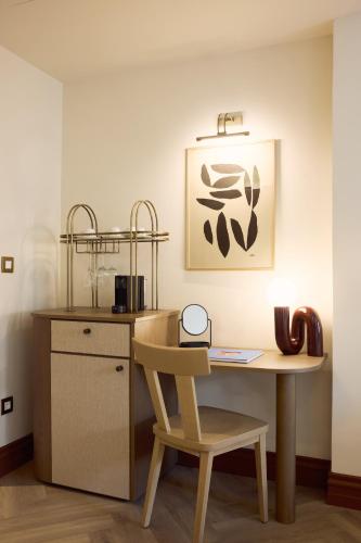 a kitchen with a table and a chair and a counter at A for Athens in Athens