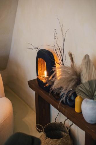 a small wood fired oven sitting on a table at Juniper Chalet Mátra in Mátraszentimre