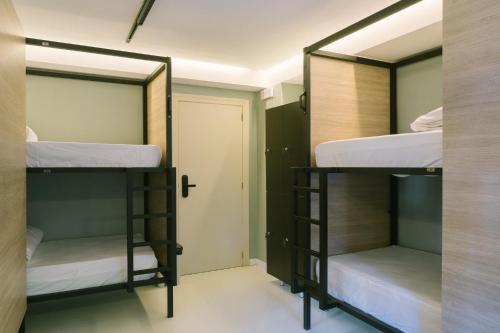 Ένα ή περισσότερα κρεβάτια σε δωμάτιο στο U-nit Hostel Central Park