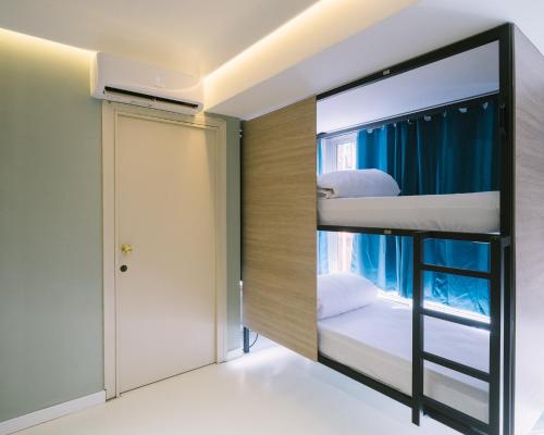 Ένα ή περισσότερα κρεβάτια σε δωμάτιο στο U-nit Hostel Central Park