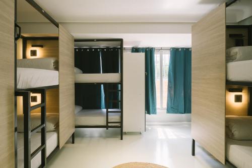 Ένα ή περισσότερα κρεβάτια σε δωμάτιο στο U-nit Hostel Central Park
