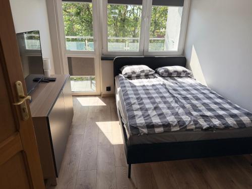 Ένα ή περισσότερα κρεβάτια σε δωμάτιο στο Ustka Centrum „ Dom Rybaka”