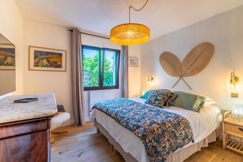 Postel nebo postele na pokoji v ubytování Villa Ilona - Villa piscine à quelques pas des plages