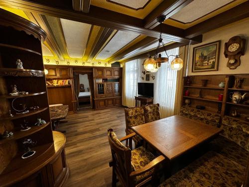 a dining room with a wooden table and chairs at Haus der Weine in Rüdesheim am Rhein