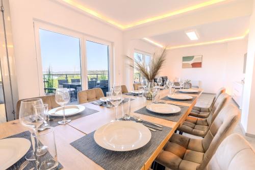 a dining room with a long table and chairs at Rhein-Lodge in Urbar-Mayen-Koblenz
