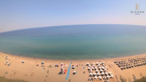 an aerial view of a beach with a group of people at Elysian Luxury Suite N1 in Flogita