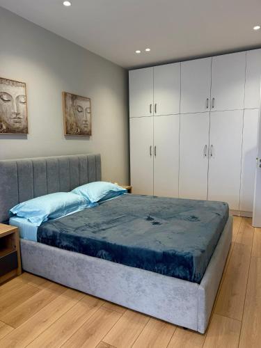 Postel nebo postele na pokoji v ubytování Flos Apartament
