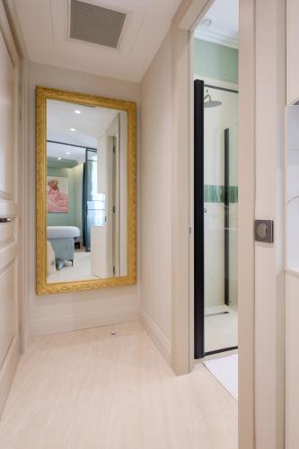 a hallway with a mirror and a room at Aparthotel 9 ALBERTI Nice Centre in Nice