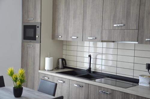 a kitchen with a sink and a counter top at Tenuta Croce in Salerno