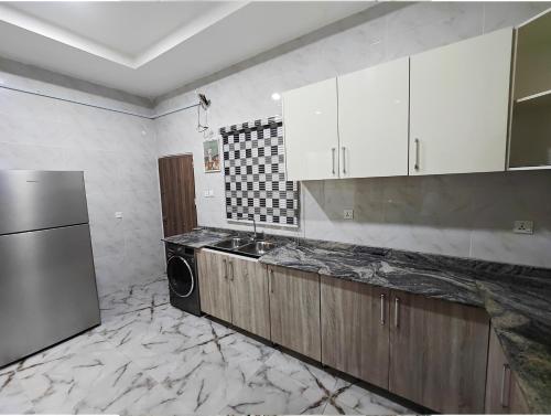 The Hub Apartment, Lekkiにあるキッチンまたは簡易キッチン