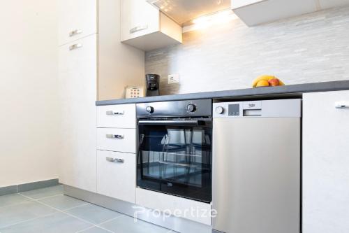 Kuchyň nebo kuchyňský kout v ubytování Istòria - by Propertize