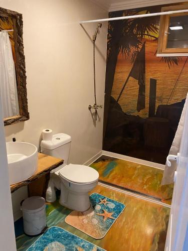 a bathroom with a toilet and a sink at Casa Flavia in Mahmudia
