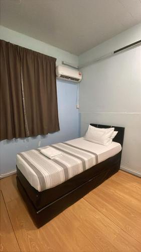 Postel nebo postele na pokoji v ubytování SC Lodging House Sinsuran Complex