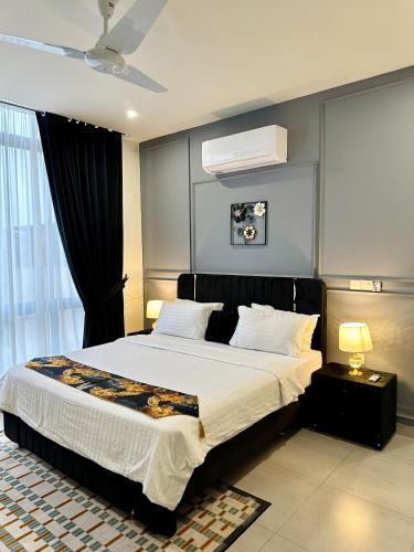 a bedroom with a large bed and a window at 2 BHK Apartment in ISLAMABAD in Islamabad