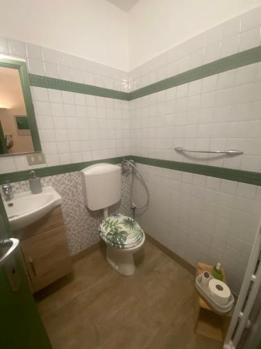 a bathroom with a toilet and a sink at L’angolo infinito in Turin