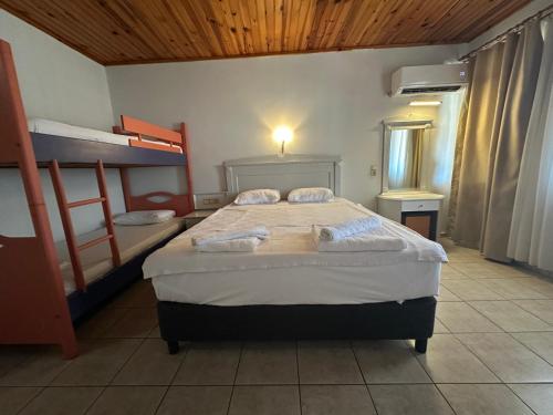 Кровать или кровати в номере Bahama Beach Konaklı