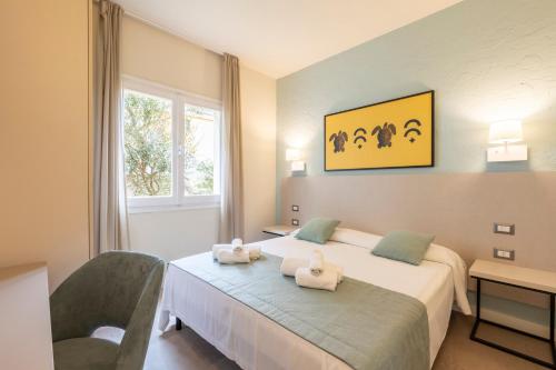 Postel nebo postele na pokoji v ubytování Baia delle Mimose Hotel