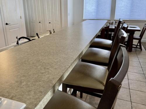 a conference room with a long table and chairs at Charming Provo Home close to BYU and Utah Lake in Provo