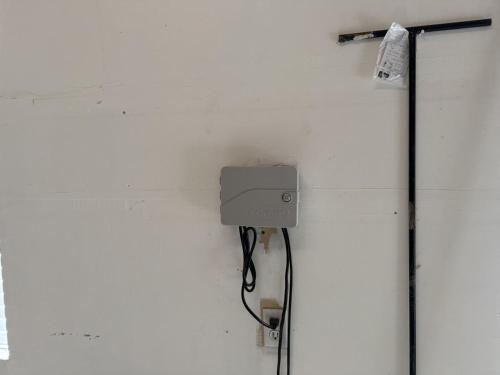 a electrical box on a white wall with a wire at Charming Provo Home close to BYU and Utah Lake in Provo