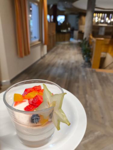 a dessert on a white plate on a table at Aktiv-Hotel Traube am Mieminger Sonnenplateau in Wildermieming