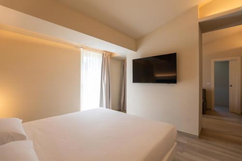 TV o dispositivi per l'intrattenimento presso Capovaticano Luxury Rooms
