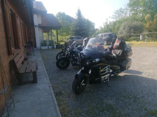 a group of motorcycles parked next to a building at Agriturismo bio Apipoli in Lucino