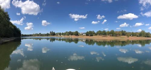 a view of a river with clouds in the water at Gite "Au Père Peinard" in Le Vibal