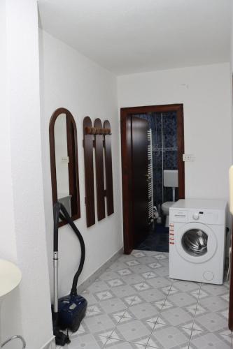 a room with a washing machine and a washer at Holiday Home Peaceful Retreat in Visoko