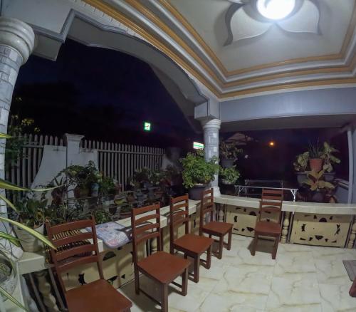 a room with a bunch of chairs and a table at Spacious Home with Great Location in Panabo City in Panabo